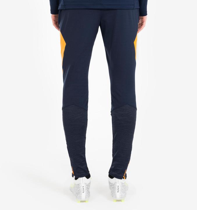Actual product image Kipsta Women's/men's football training trousers - CLR orange/navy blue (W34/L34)