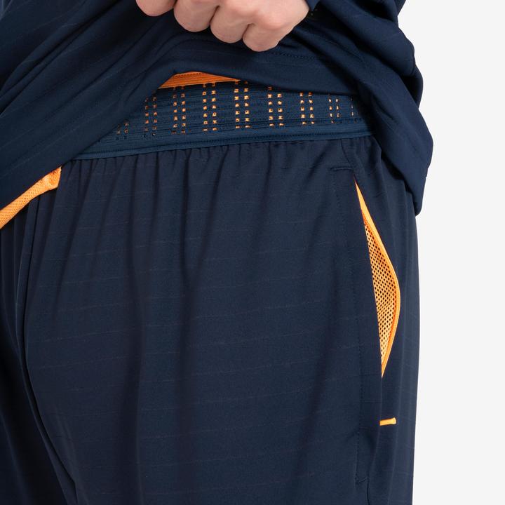 Actual product image Kipsta Women's/men's football training trousers - CLR orange/navy blue (W34/L34)