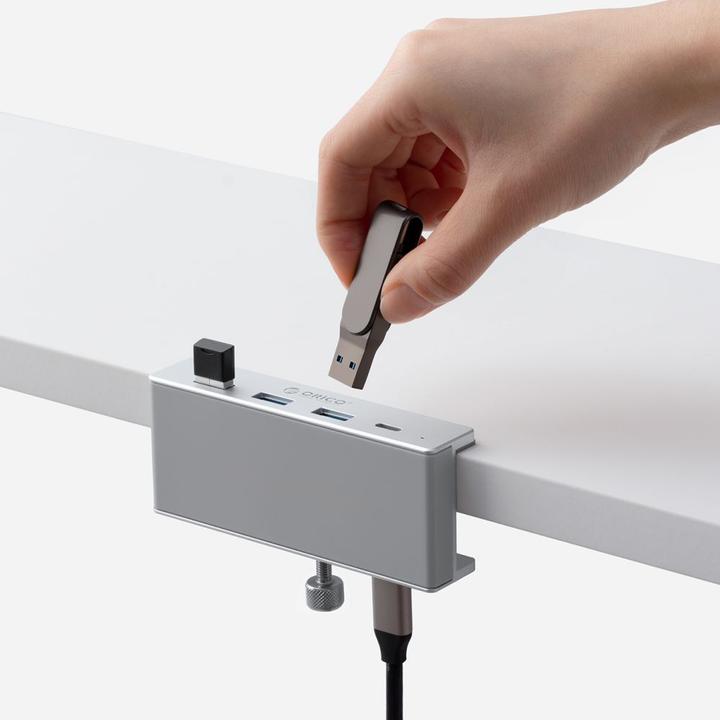Immagine prodotto Orico Converter MH4PC Hub Clamp-Mounted USB-C / 3x USB-A 3.0 + 1x USB-C 3.0 - Silver (USB-C)
