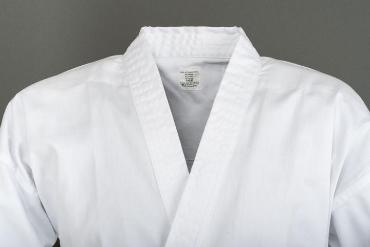 Immagine prodotto Budo.ch Anzug Training weiss flacher Stoff (leichte Ausführung, Gummibund (L)