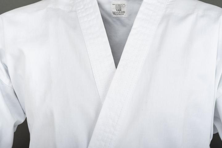 Immagine prodotto Budo.ch Anzug Training weiss flacher Stoff (leichte Ausführung, Gummibund (L)