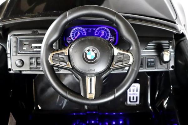 Immagine prodotto Es-toys Auto elettrica per bambini "BMW M5" - con licenza - batteria 24V, MP3, sedile in pelle + EVA - nero (24 V)