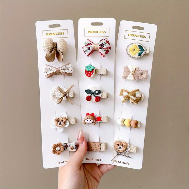 Immagine prodotto Activity Board 15/20pz simpatici fermagli per capelli a fiocco con faccia sorridente di animali dei cartoni (20 pz.)