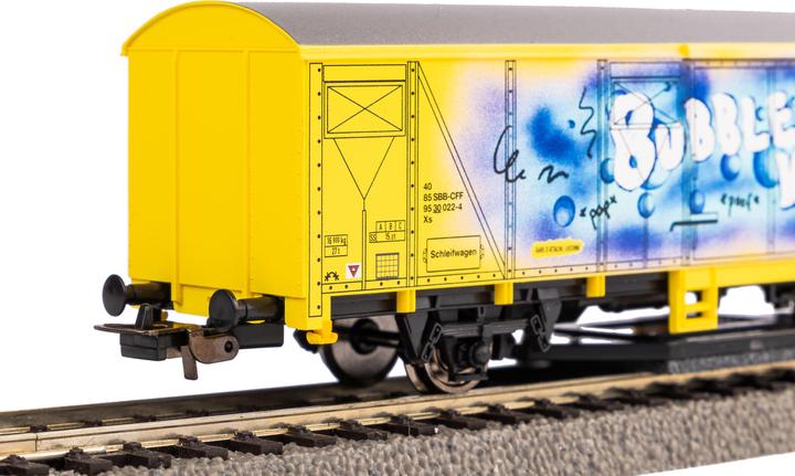 Immagine prodotto Piko H0 54309 H0 Carro per la pulizia delle rotaie giallo con graffiti FFS (Traccia H0)