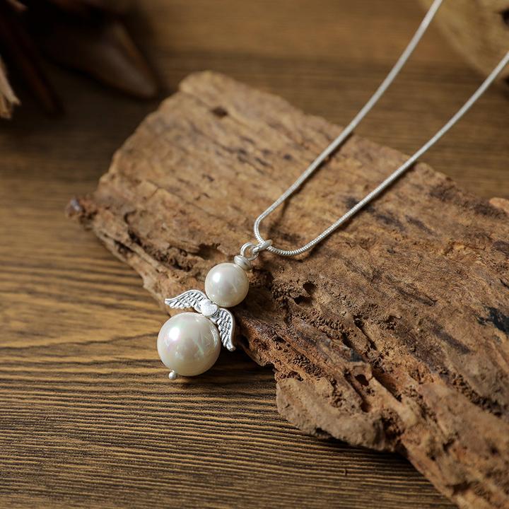 Andreani Halskette mit kleinem Engelanhänger aus echtem Shellbead (Shellbead)