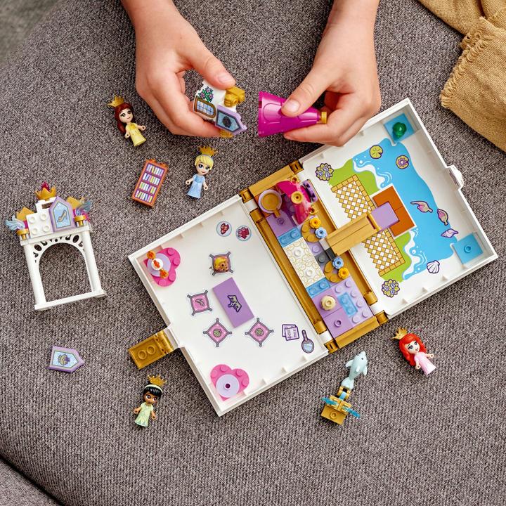 Produktbild LEGO Märchenbuch Abenteuer mit Arielle, Belle, Cinderella und Tiana (43193, LEGO Disney)