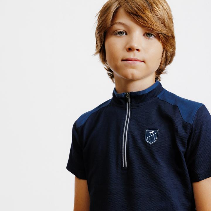 Immagine prodotto Fouganza Polo da equitazione per bambini con zip e manica corta - 500 blu scuro (122)