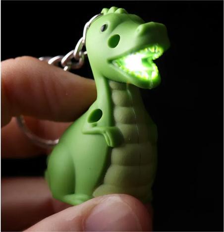 Produktbild Roost Schlüsselanhänger Dino KEY59 LED 10x2.5x4cm