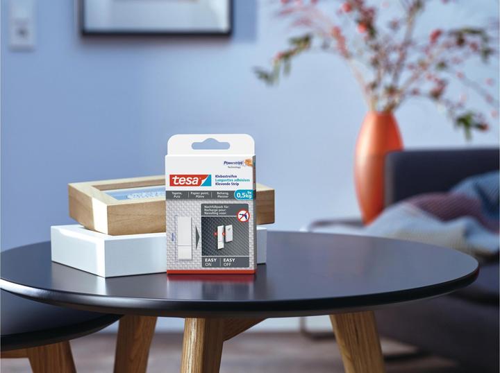 Produktbild tesa Powerstrips für Tapete & Putz, 0,5kg Halteleistung, 9x doppelseitige Klebestreifen