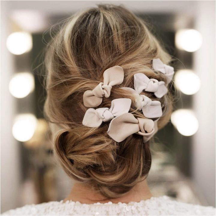 Immagine prodotto Corinne Mondo - Fiocco di pelle piccolo su clip per capelli bianco