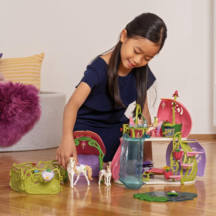 Produktbild Schleich Glitzerndes Blütenhaus mit Einhörnern, See und Stall