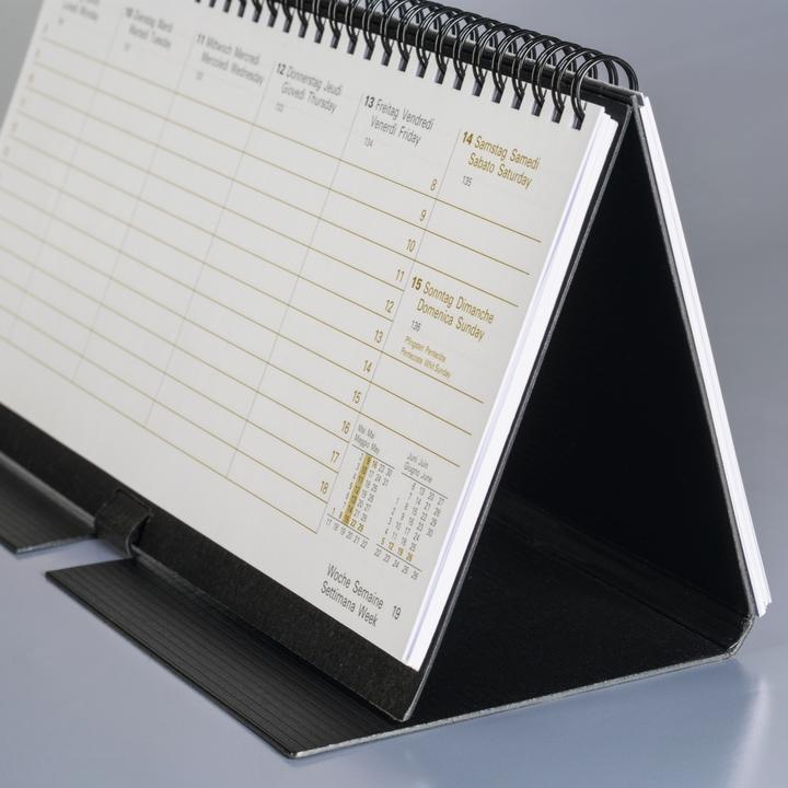 Produktbild Tischkalender. 2025 087060905 1W/2S schwarz ML 28x12cm (Spezial, Deutsch, Französisch, Englisch, Italienisch)