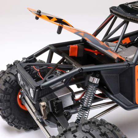 Actual product image Axial UTB10 Capra 1.9 1/10 4WS 4X4 RTR Brushed Rock Crawler, orange (RTR Ready-to-Run)