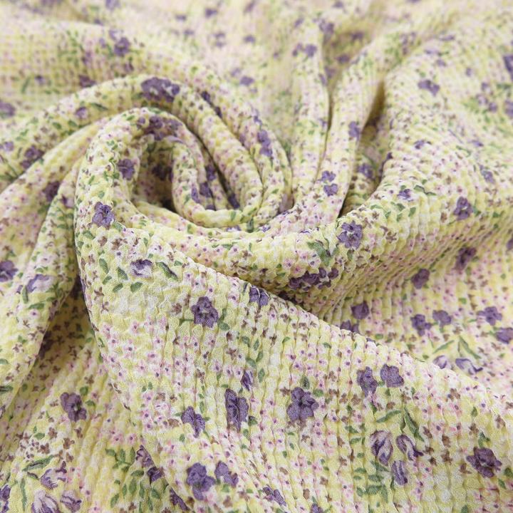 Immagine prodotto Stoffrestposten Chiffon plissettato - Fiori sparsi in giallo pastello - Quantità minima: 1 metro