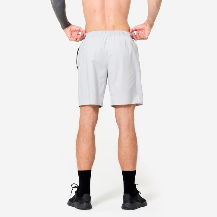 Image du produit Domyos Short de fitness respirant poches zippés homme, gris perle (L)