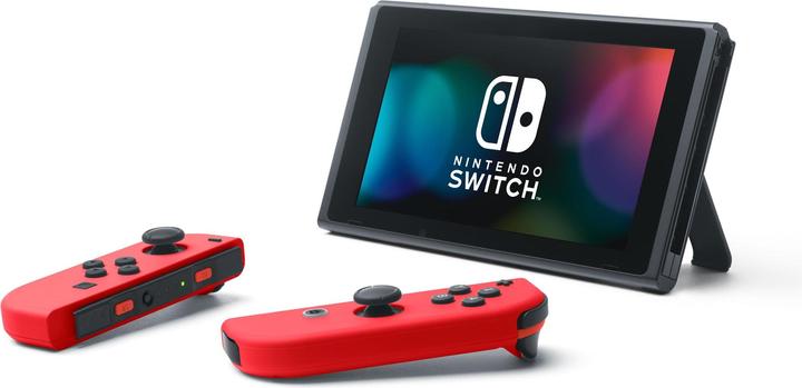 Image du produit Nintendo Switch Rouge + Code de téléchargement Super Mario Odyssey + Autocollant du film Super Mario Bros.