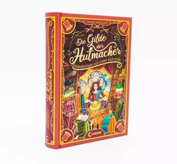 Produktbild Die Gilde der Hutmacher (Die magischen Gilden, Band 1) - Geheimnisse aus Stoff und Seide (Deutsch, Tamzin Merchant, Paola Escobar, Nadine Mannchen, 2022)