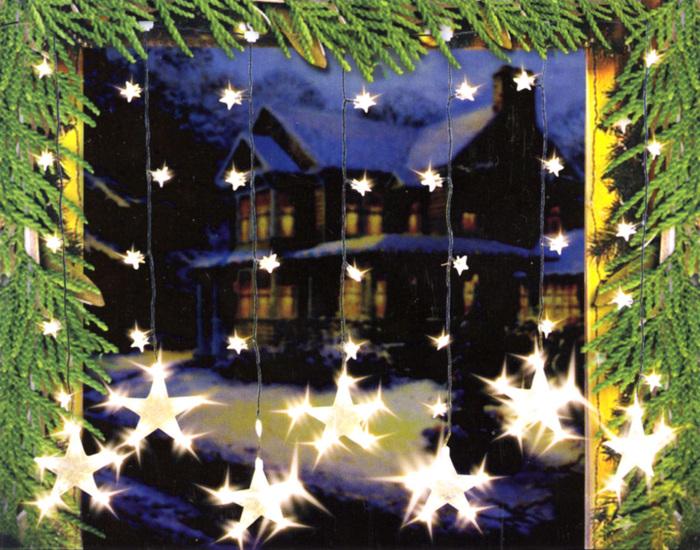 Immagine prodotto Swisshandel24 Tenda luminosa a LED con catena di stelle Deco - 7 stelle grandi, 32 stelle piccole (1 m)