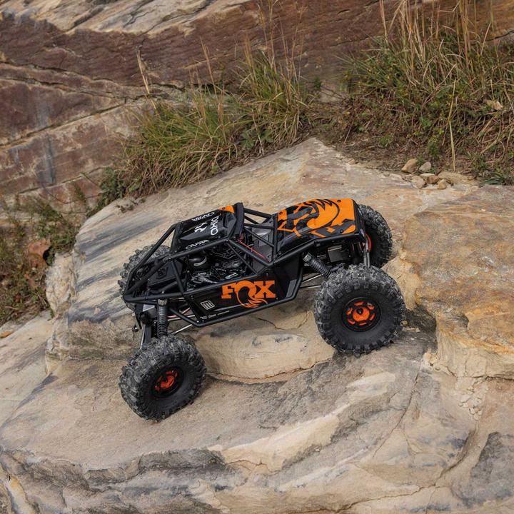 Actual product image Axial UTB10 Capra 1.9 1/10 4WS 4X4 RTR Brushed Rock Crawler, orange (RTR Ready-to-Run)