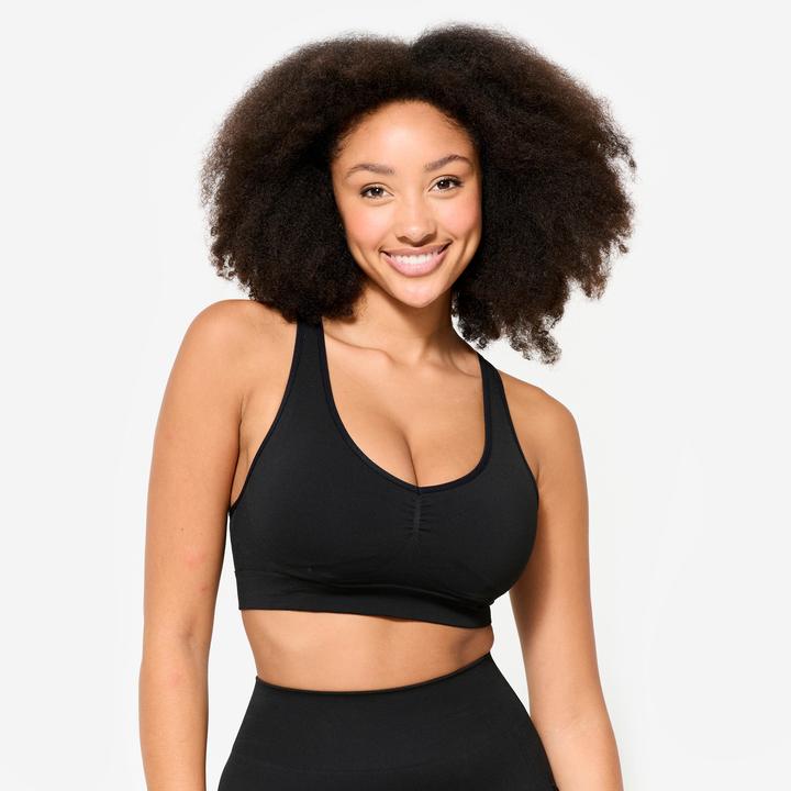 Actual product image Decathlon Women's sports bra light support crossed straps - black (M)