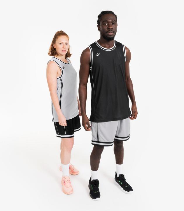 Immagine prodotto Kipsta Damen/Herren Basketball Trikot wendbar leicht - SHR 500 schwarz-weiss (XS)