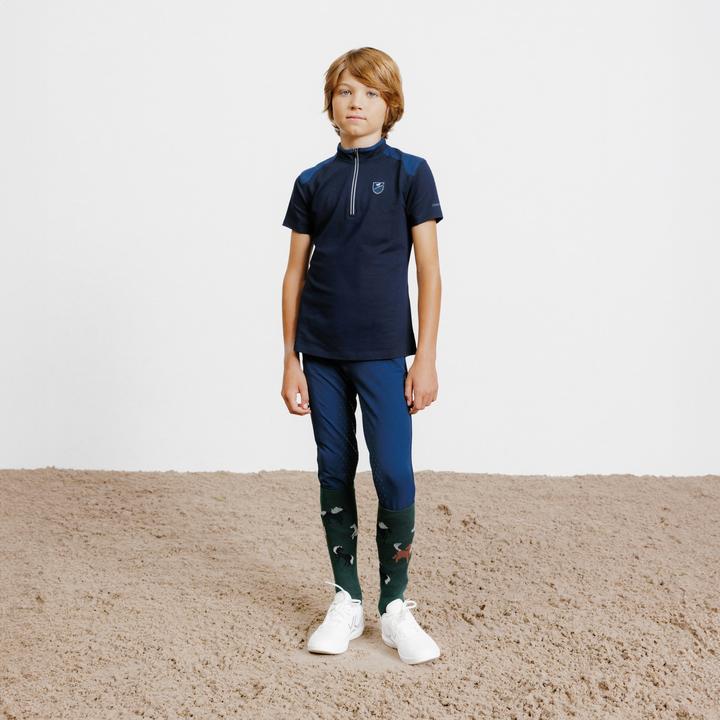 Immagine prodotto Fouganza Polo da equitazione per bambini con zip e manica corta - 500 blu scuro (122)