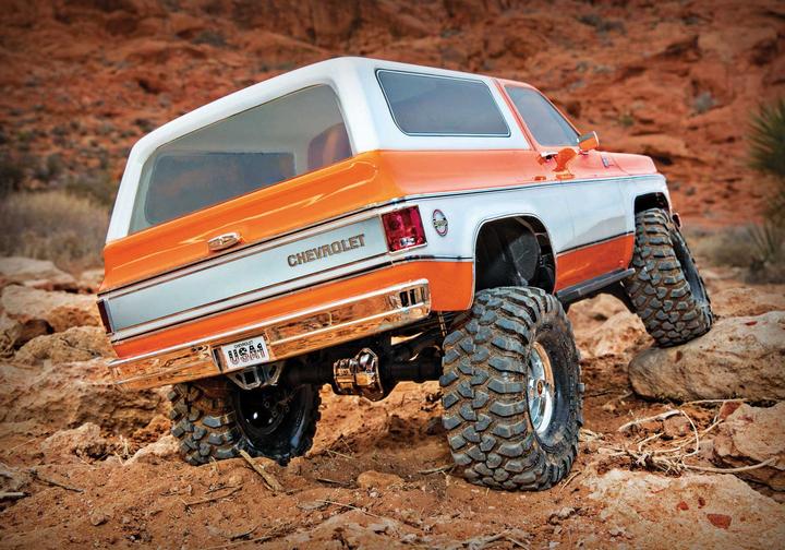 Immagine prodotto Traxxas TRX-4 79 Chevy Blazer arancione/bianco 1/10 Crawler RTR spazzolato, Clipless, senza batteria e (RTR pronto all'uso)