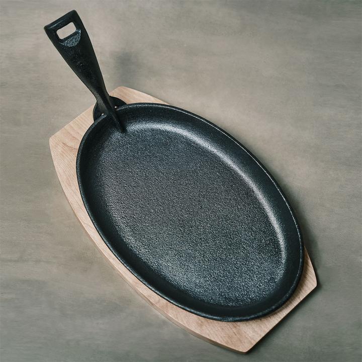 Immagine prodotto Casativo Padella professionale in ghisa con sottopentola in legno, 24 x 14 x 2,2 cm (Padella per friggere, Ghisa)