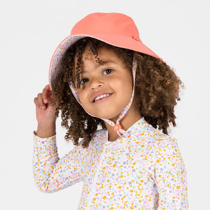 Immagine prodotto Nabaiji UV-Mütze wendbar Baby koralle/Blumendruck (95 C)