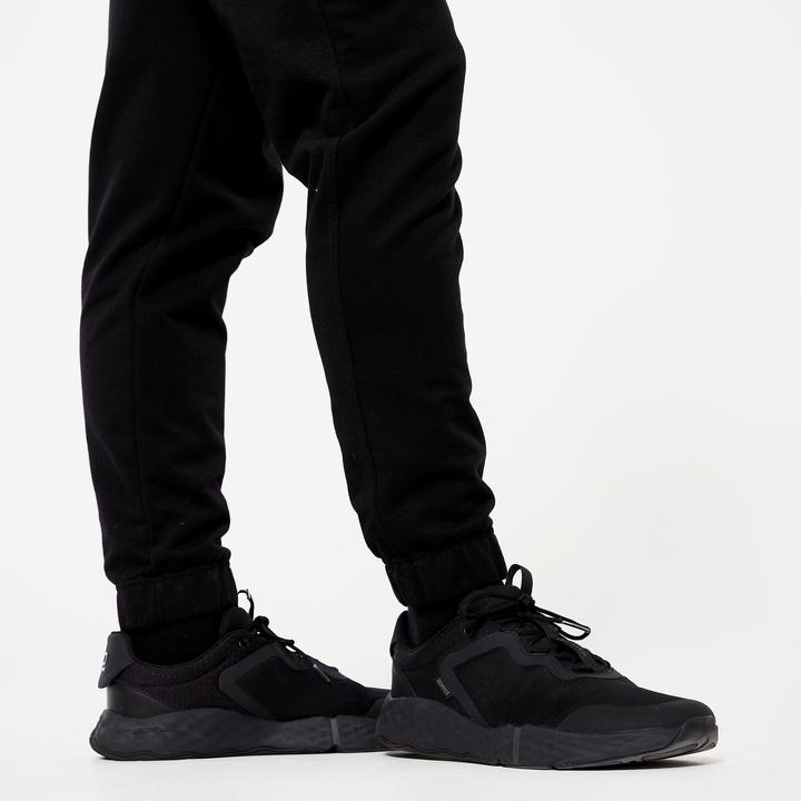 Immagine prodotto Domyos Pantaloni da jogging caldi da uomo - 100 nero (W34/L34)