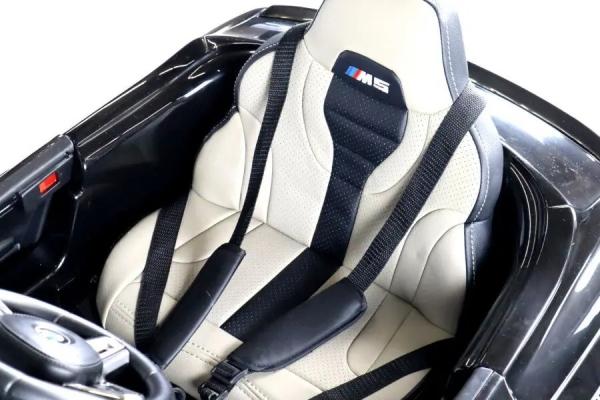 Immagine prodotto Es-toys Auto elettrica per bambini "BMW M5" - con licenza - batteria 24V, MP3, sedile in pelle + EVA - nero (24 V)
