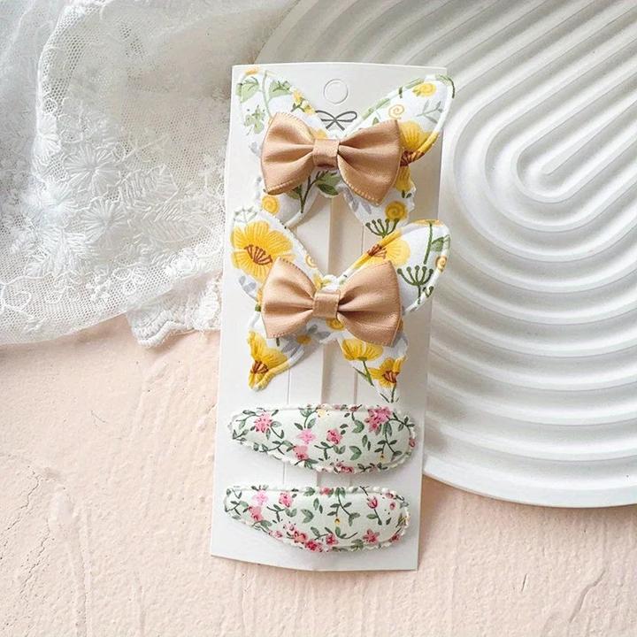 Actual product image Activity Board 4 Stück elegante Schleifen-Haarspangen - Polyester, geflochtene, florale und einfarbige Designs (4 pcs.)