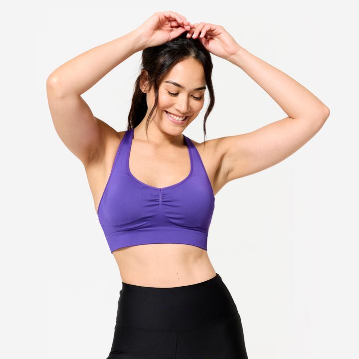 Actual product image Decathlon Women's sports bustier with crossed straps for light support - purple (XL)